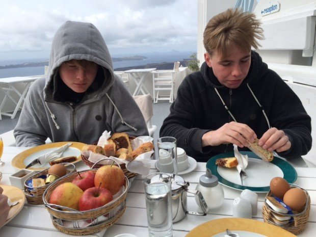 Breakfast outside in the cold rain. Santorini, Greece